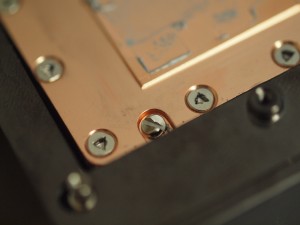 The security screws on the bottom plate of the R9 Fury X consist of four one way slotted screws and a few 1.5 mm triangle shaped ones